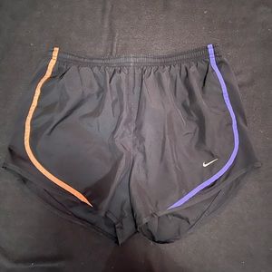 Nike. Size M. Black and colorful stripes.